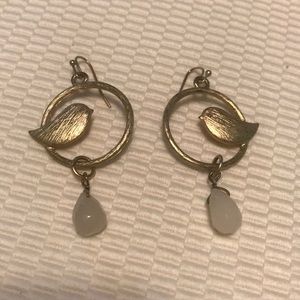 Fashion gold dangle earrings with bird motif.